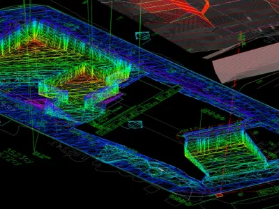 Full 3D terrain grading model of a Malibu hillside site in rainbow spectrum colors showing cut and fill volumes along the Pacific Coast Highway corridor
