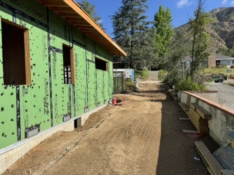 Altadena construction site with rough soil driveway awaiting pavement following our drainage plan approval