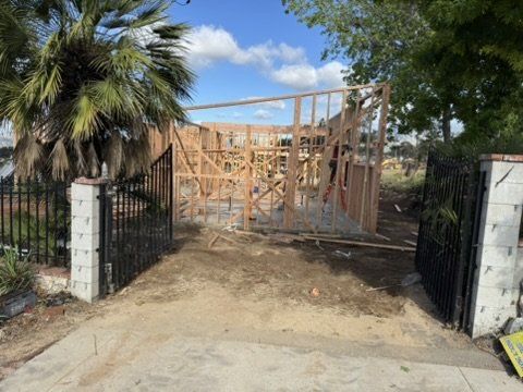 Existing driveway on Altadena lot to be relocated for new construction with underground fire tank at rear