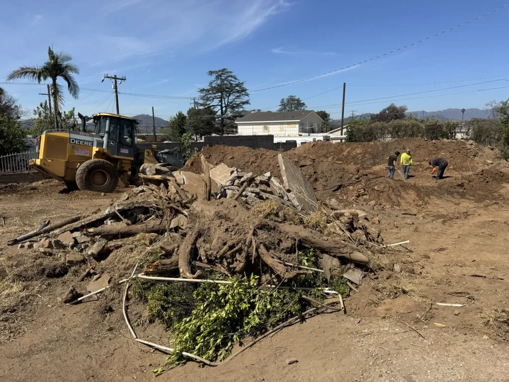 Post-fire site clearing and stump removal at an Altadena Glenrose Avenue fire rebuild lot showing how cleared land changes stormwater flow