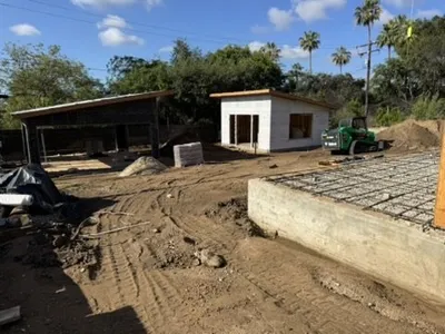 Altadena construction site featuring guest house foundation with dual rain garden drainage design