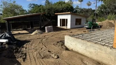 Altadena construction site featuring guest house foundation with dual rain garden drainage design