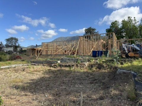 Altadena home under construction with mountain views featuring our drainage and fire tank design