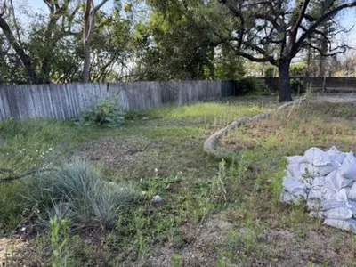 Altadena lot showing erosion control with wattle and sandbags during rebuild