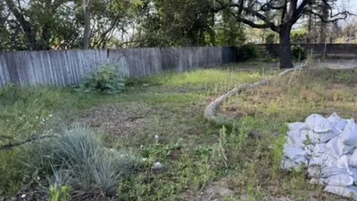 Altadena lot showing erosion control with wattle and sandbags during rebuild
