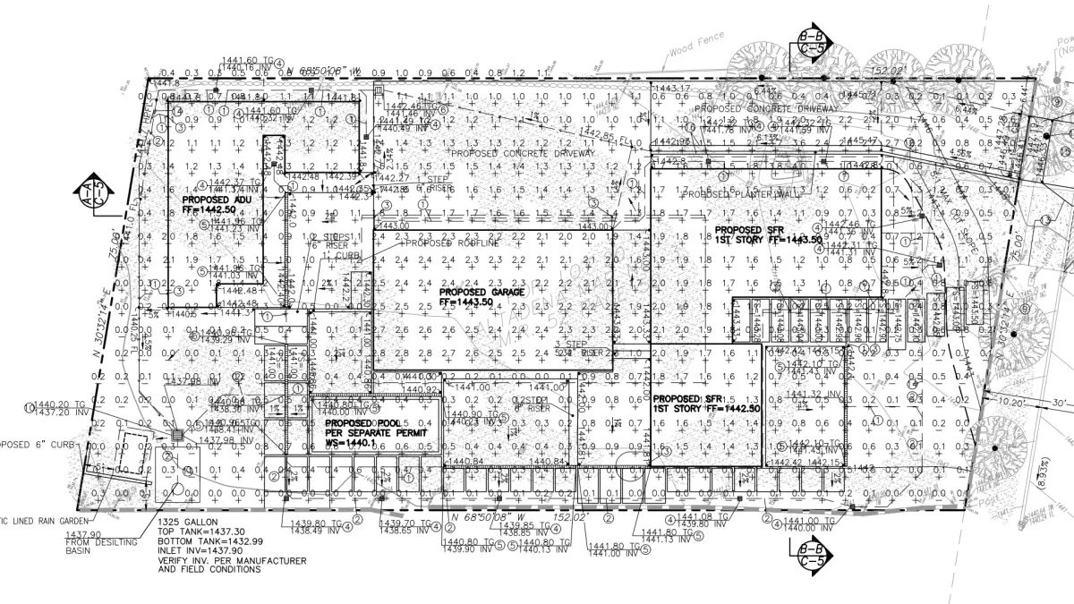 Earthwork exhibit showing 1325-gallon underground fire tank, downspouts, trench drains, and lined rain garden for Altadena residence