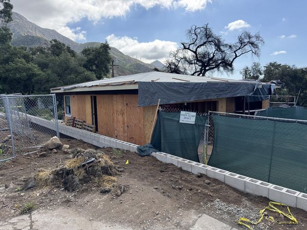 Altadena residential rebuild under construction with plywood walls following our approved grading plan