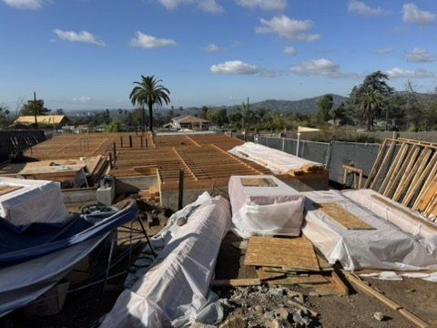 Altadena residential rebuild under construction with floor framing underway following our drainage plan design