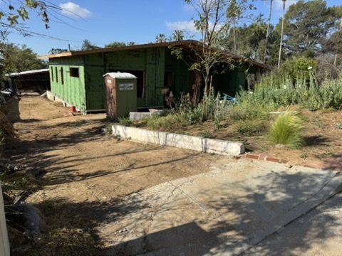 Altadena residential rebuild under construction following our drainage plan with green wall sheathing