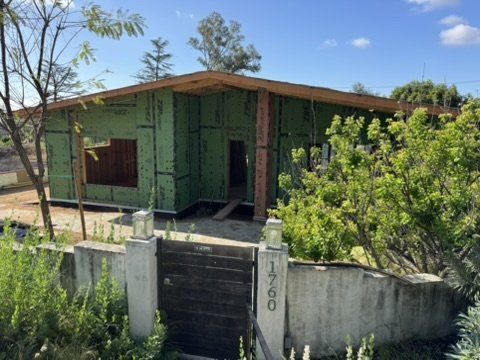 Altadena single-story home under construction with roof framing exposing our drainage plan design