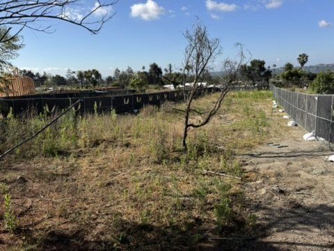 Vacant Altadena lot with natural slope requiring drainage design for residential rebuild