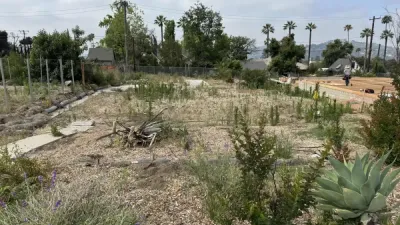 Construction site overview showing prepared building pad and drainage routing for Altadena fire rebuild