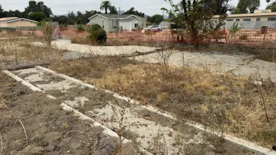 Pre-construction view of the Altadena W Mendocino Ave fire rebuild lot showing cleared site conditions