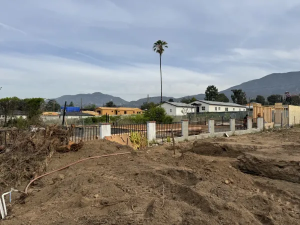 Excavated dirt and trenches at Altadena residential fire rebuild construction site