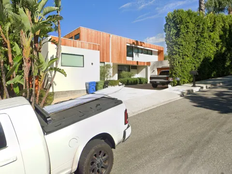 Alto Cedro Drive - Completed luxury residence in Beverly Hills with cedar wood cladding and permeable paver motorcourt