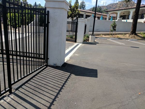 Chevy Chase Country Club entrance gate with our grading plan managing site drainage