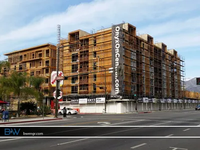Onyx on Central apartment building under construction with wood framing and scaffolding in Glendale