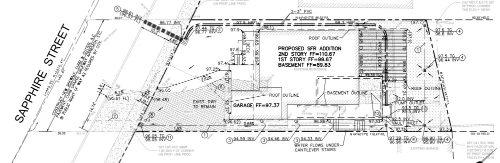 Grading plan for Redondo Beach residence showing proposed addition, drainage system, area drains, and sump pump location