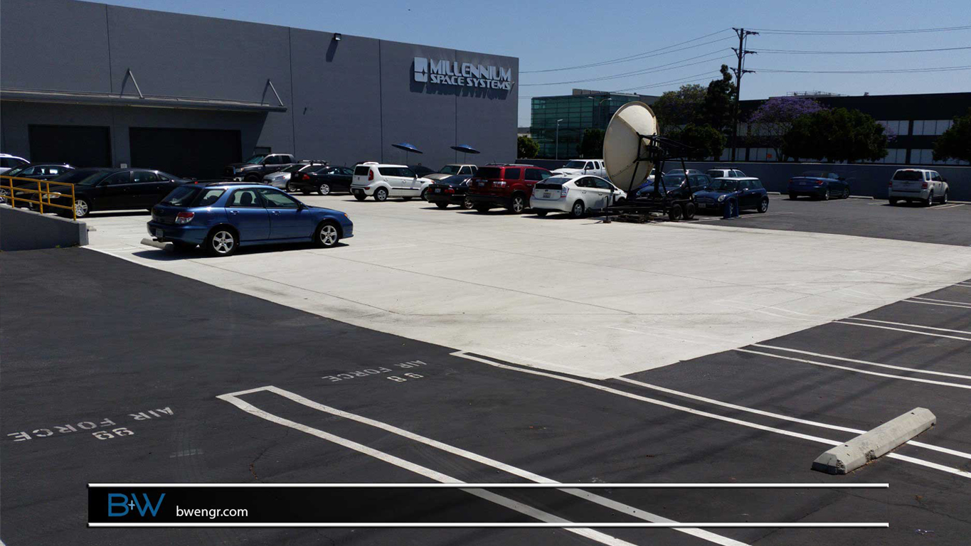 Photo showcasing the collaborative project between B+W Engineering and Design and Partners by Design for Aerovoice in El Segundo. The image displays the revamped parking lot, expertly repaved, along with the strategic infill of loading docks, enhancing the functionality and aesthetics of the facility's exterior.